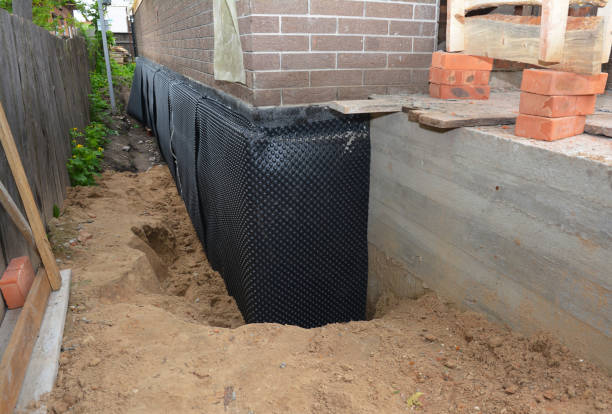 SJ Waterproofing Pros technician performing targeted Exterior Waterproofing assessment in Brownsville, IN